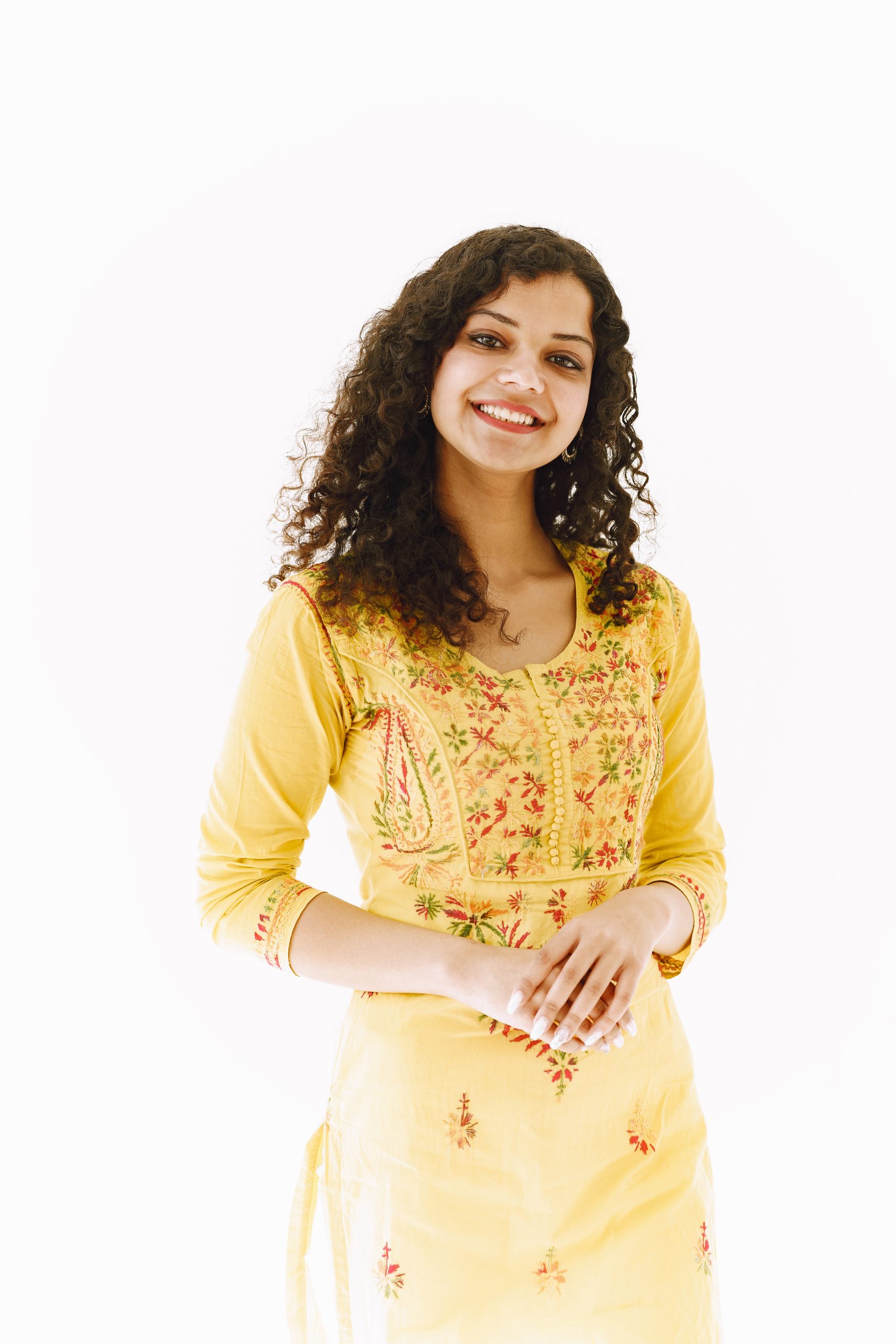 Cheerful traditional Indian woman on white background. Studio shot.